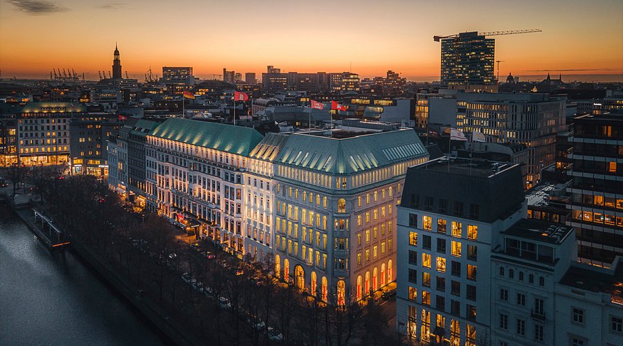 Historic white facade of the Fairmont Hotel Vier Jahreszeiten on Lake Alster, Hamburg